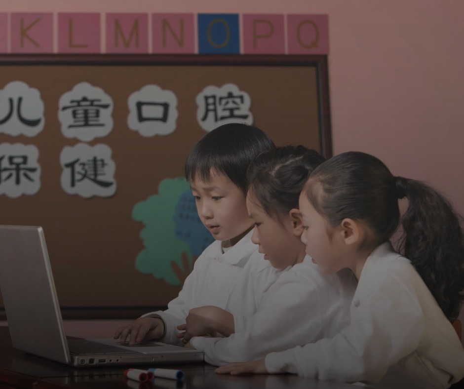 Chinese students learning artificial intelligence in classroom with computers