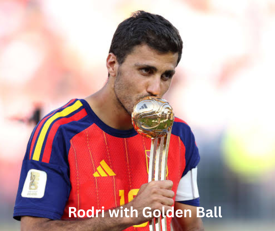 Spain captain Rodri holding the FIFA World Cup trophy and the Golden Ball award after the final